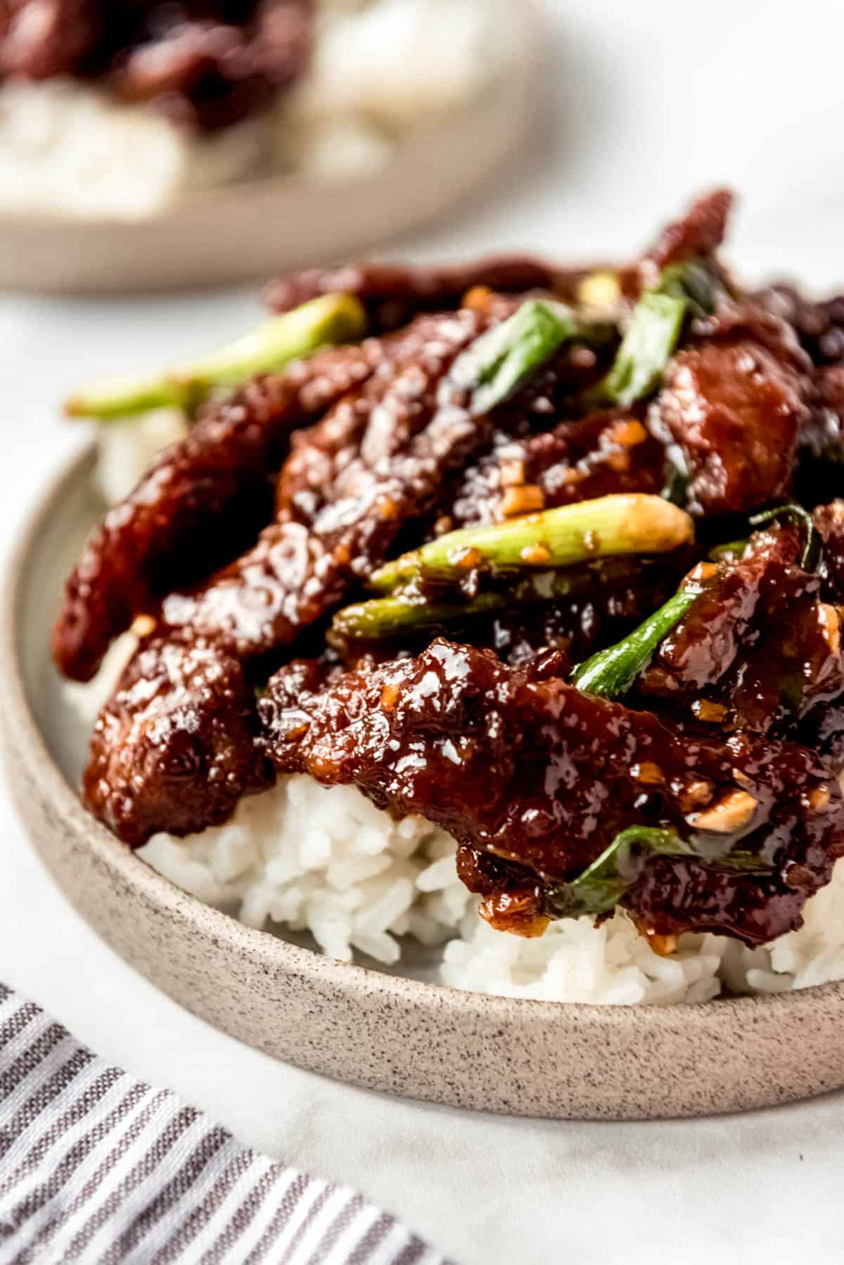 Mongolian Beef in bowl on rice. 