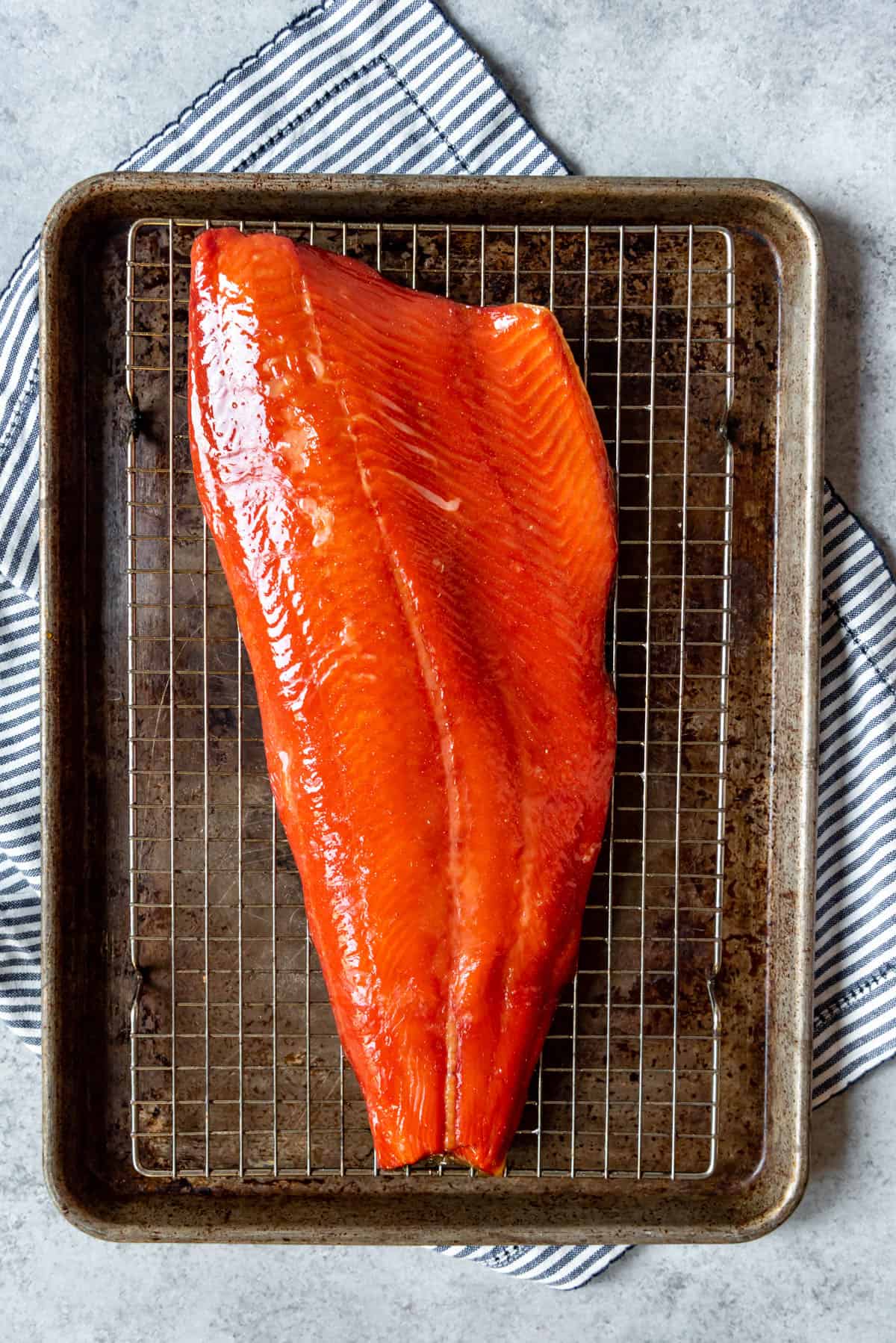 An image of a large piece of wild caught salmon that has been brined, cured, and smoked on a pellet smoker.
