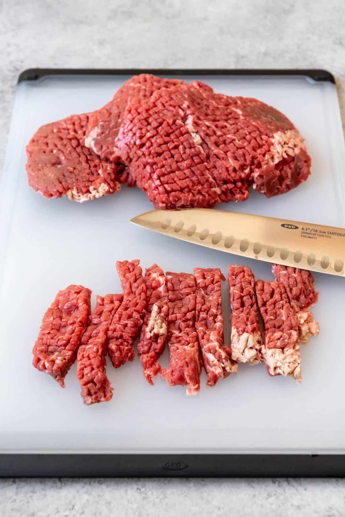 Steak pounded thin and cut into strips.