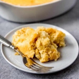An image of Creamy Corn Casserole on plate with a fork.
