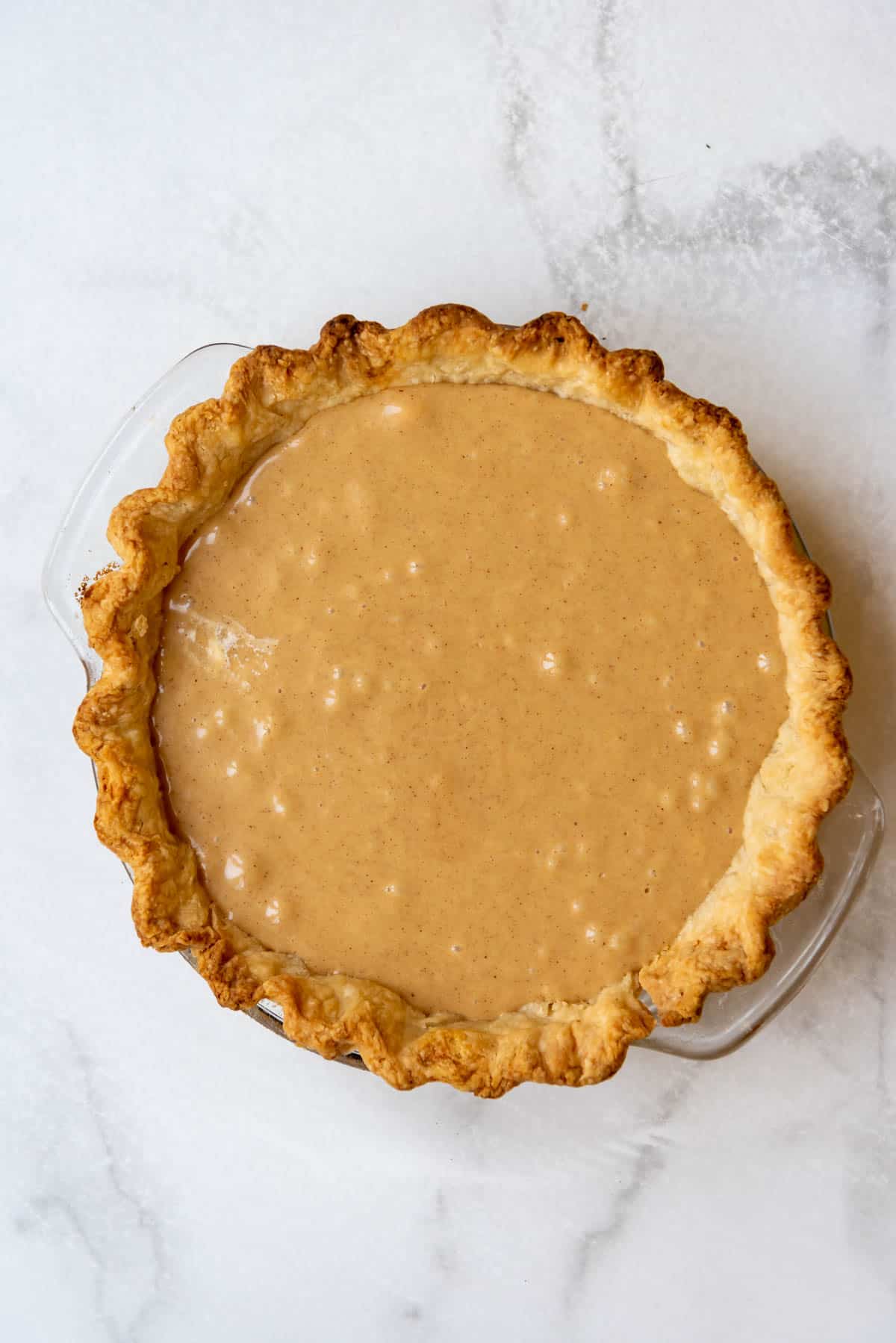Peanut butter nougat filling in a baked pie crust.