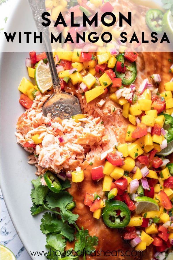 An image of flaking salmon with mango salsa and text overlay.