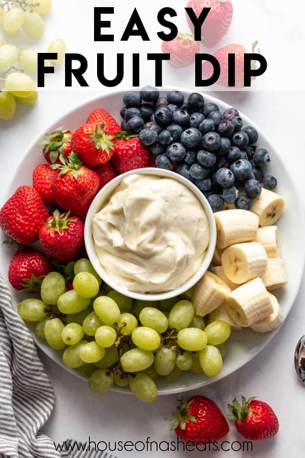 A bowl of fruit dip surrounded by fresh fruit with text overlay.