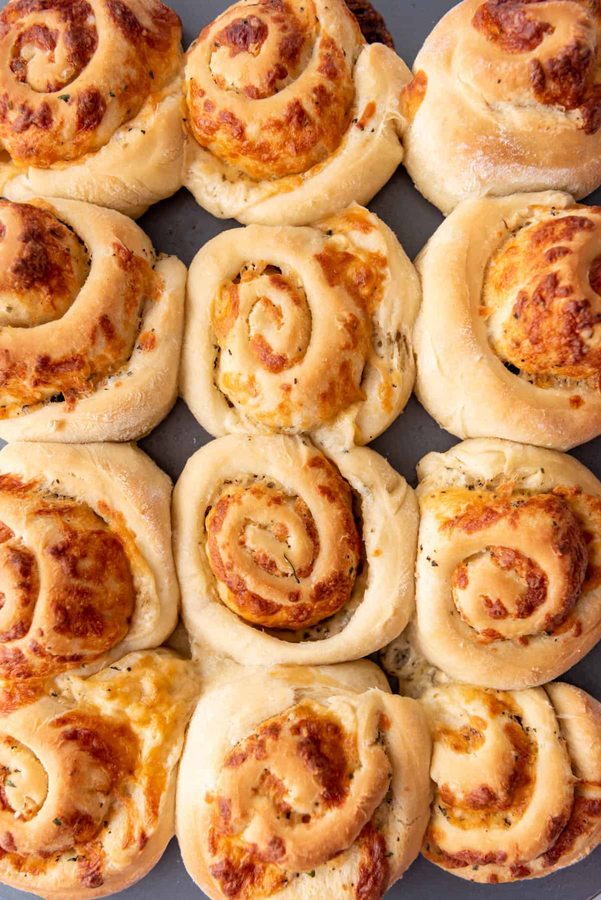 A close up image of savory swirled garlic mozzarella cheese rolls.