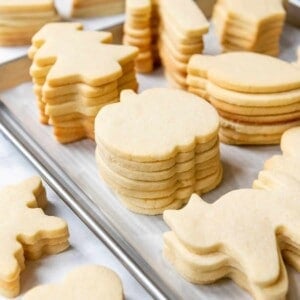 Stacks of unfrosted sugar cookies ready for icing.