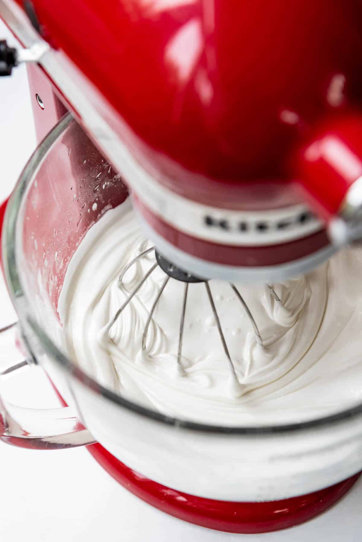 An image of white royal icing in a stand mixer.
