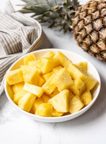 A bowlful of fresh pineapple chunks.