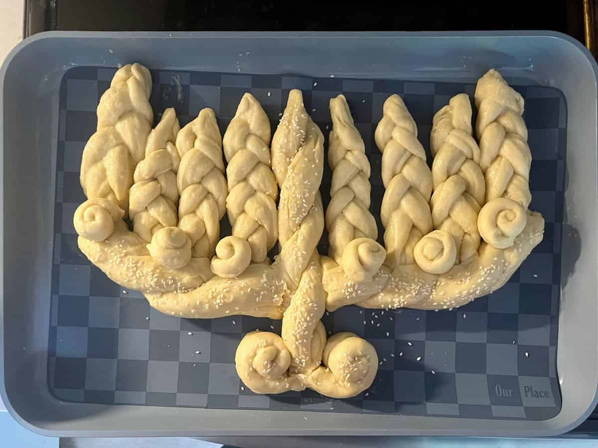 Challah bread dough braided and shaped like a menorah.