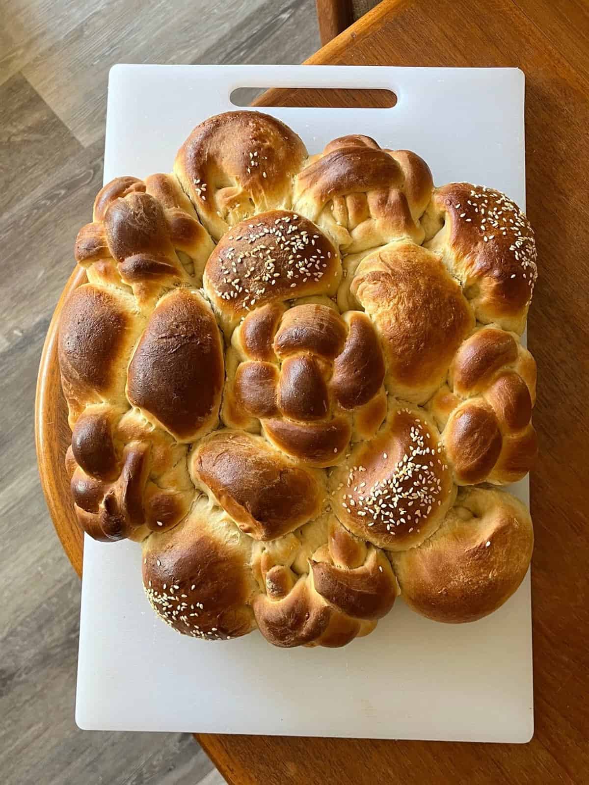 An intricately braided loaf of challah bread.
