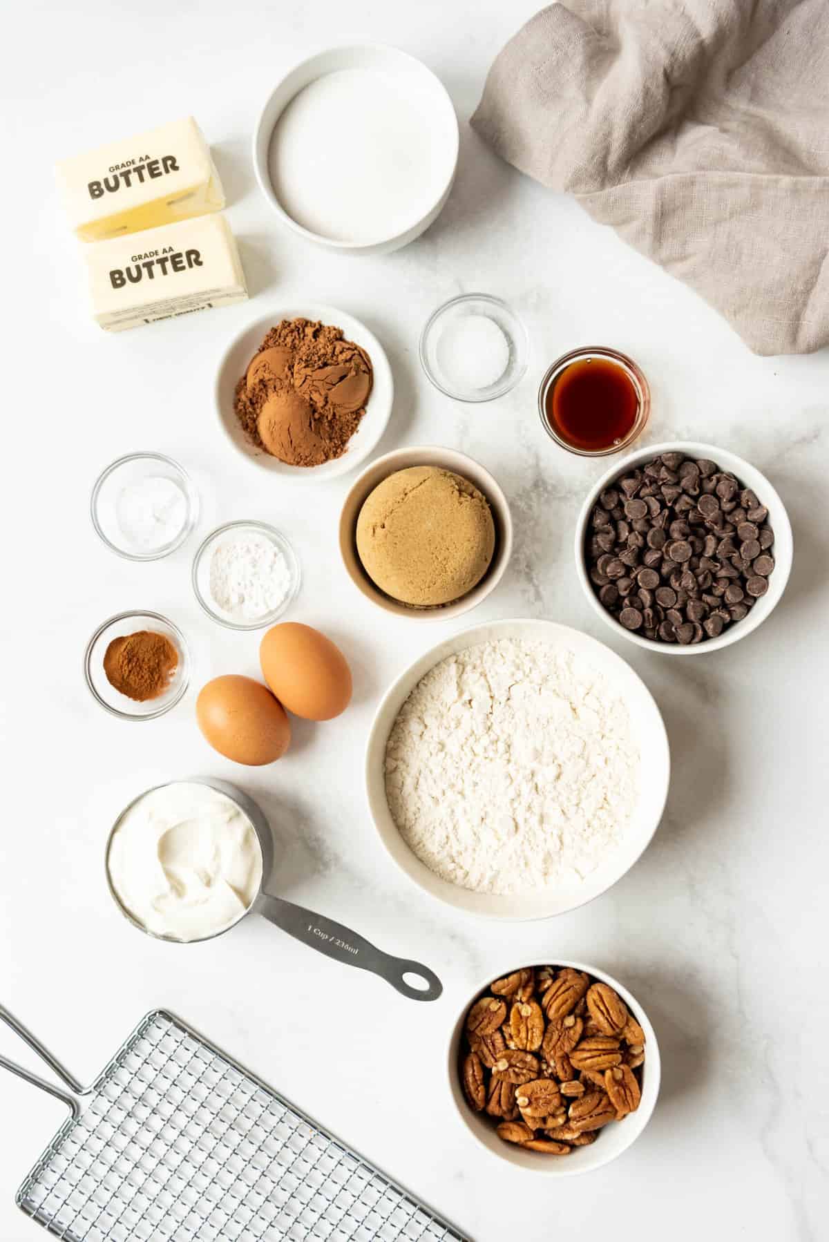 Ingredients for chocolate pecan crumb cake in separate bowls.