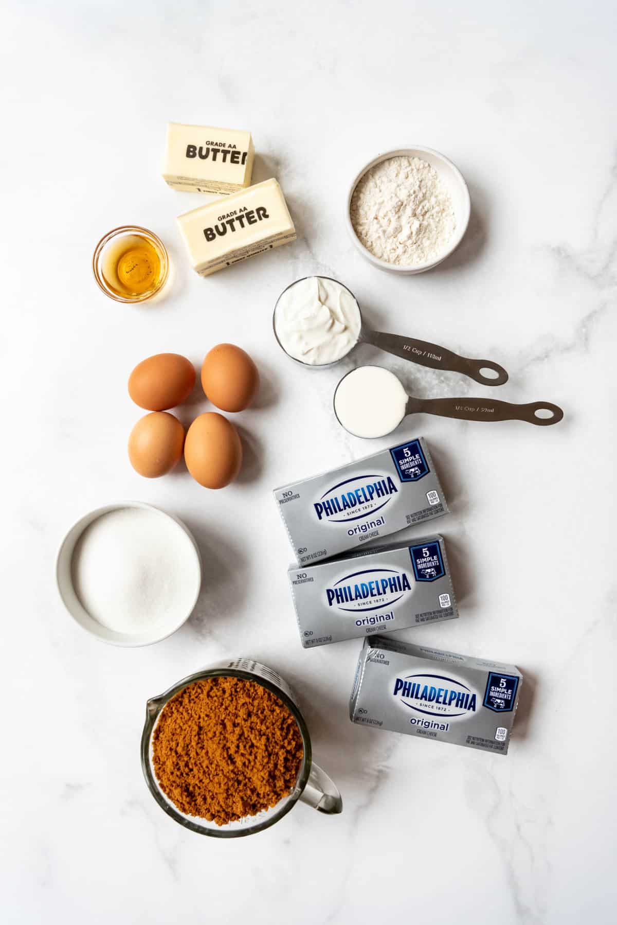 Ingredients for a cinnamon roll cheesecake recipe.