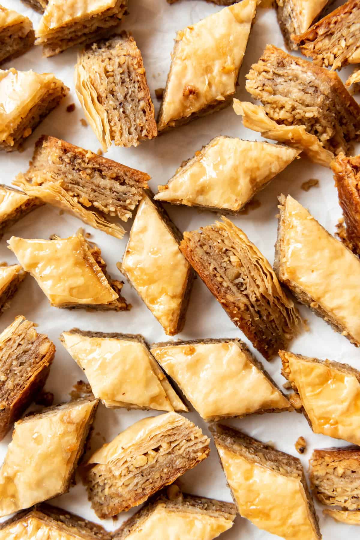 Diamond-shaped pieces of homemade baklava with honey and walnuts.