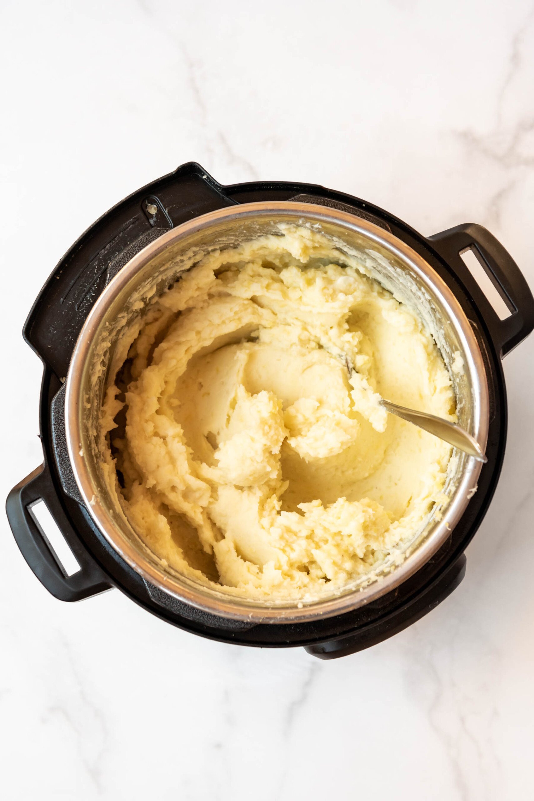 Top view of creamy mashed potatoes in an instant pot.