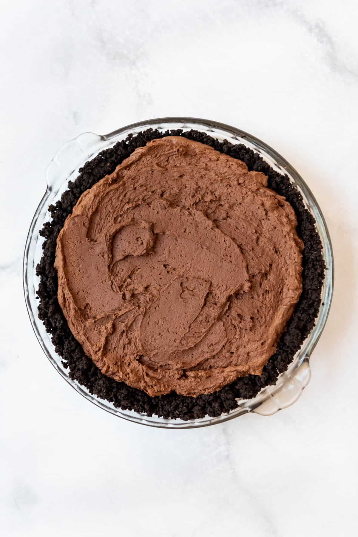 The chocolate mousse layer spread onto a Mississippi mud pie.
