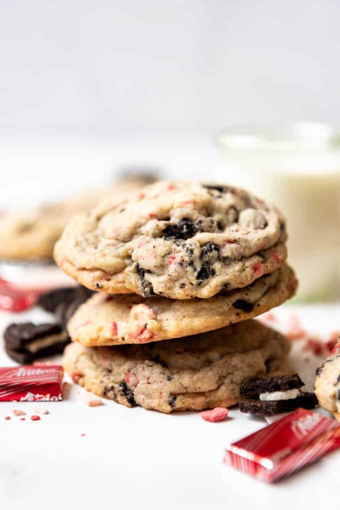 A stack of three peppermint Oreo cookies made with Andes peppermint crunch thins.