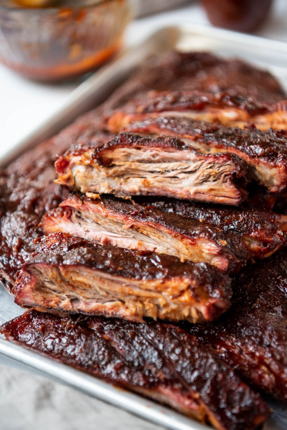 A close image of smoked St. Louis style ribs.