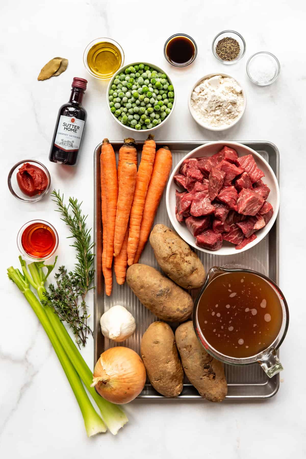 Top view of ingredients needed to make beef stew recipe. 