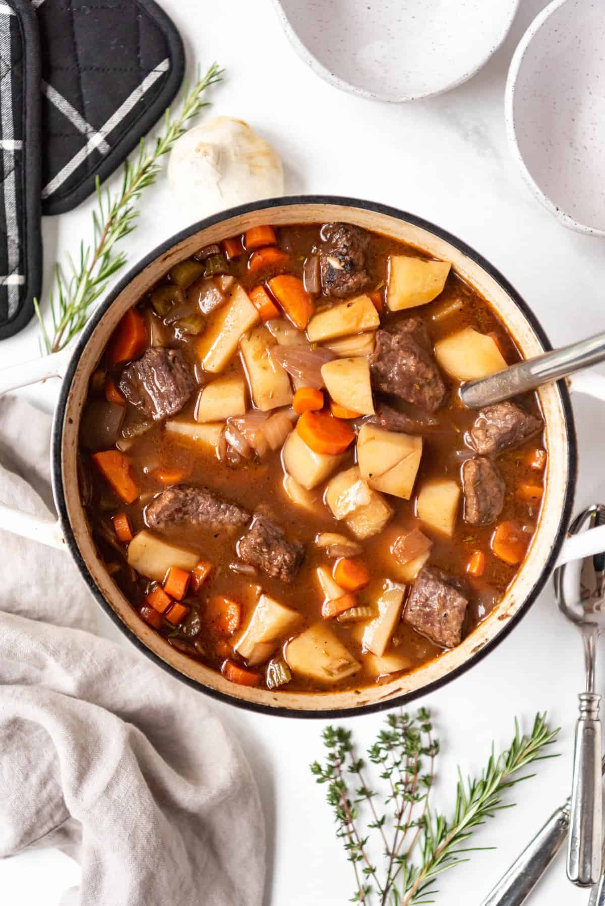 An overhead image of a pot of old-fashioned beef stew.