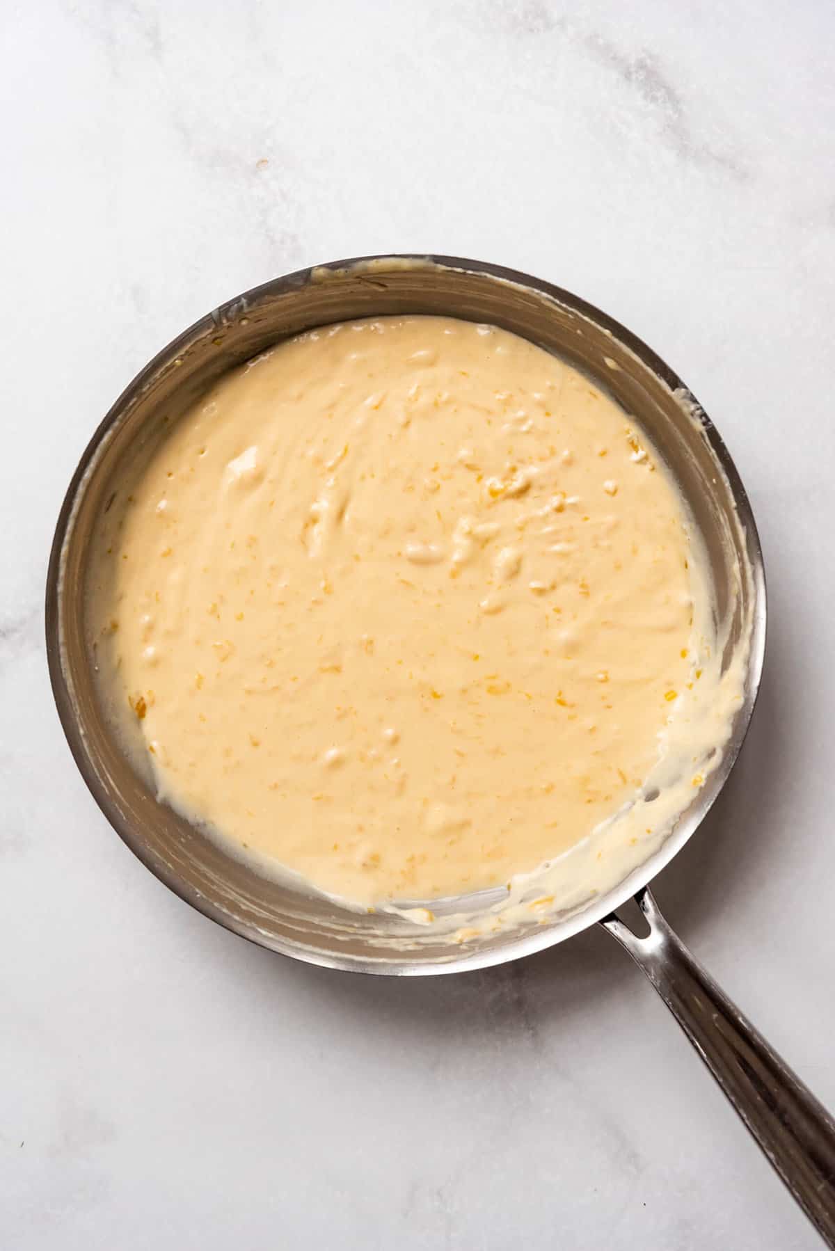 Creamy cheese sauce in a pan.