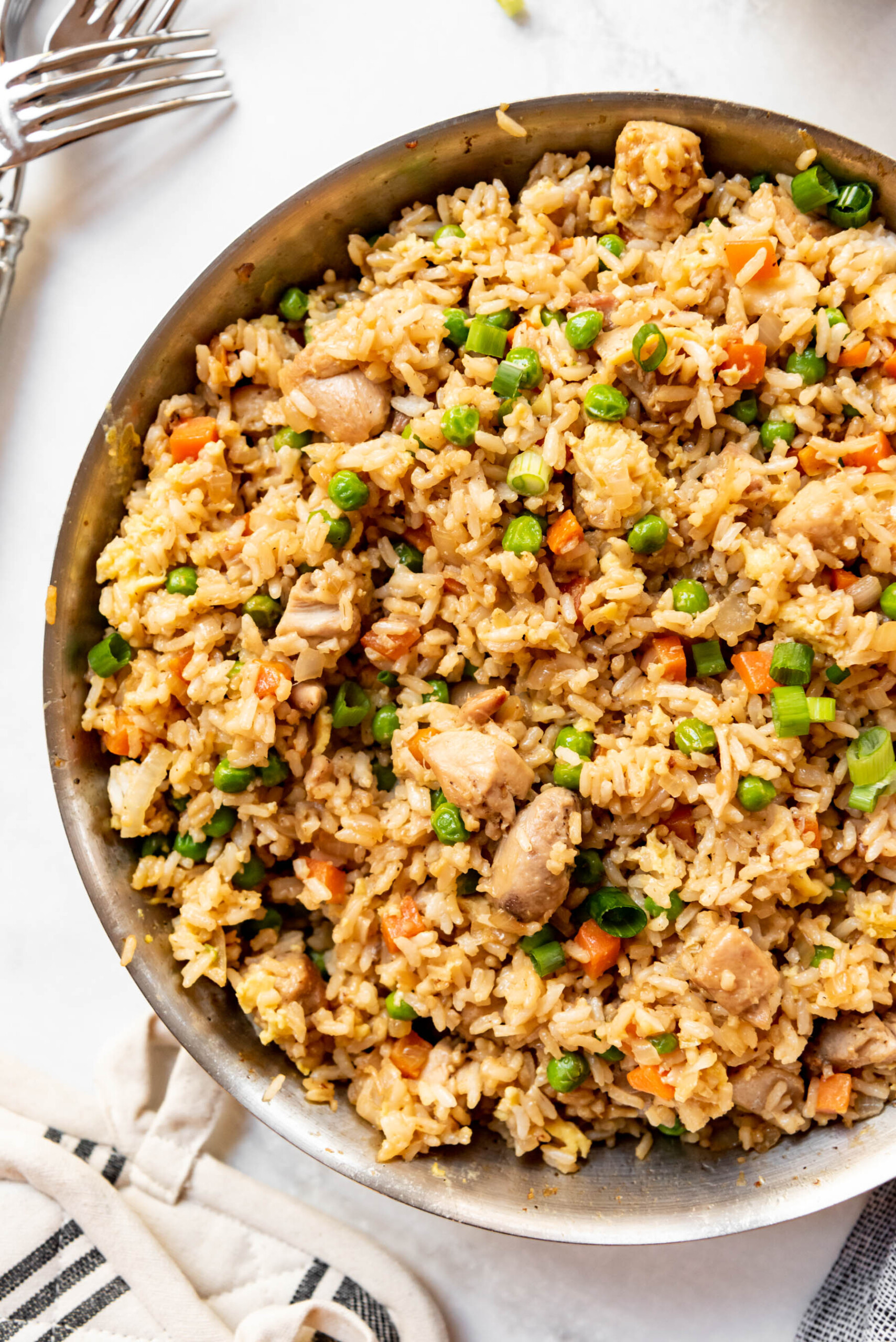 A close image of homemade chicken fried rice in a pan.