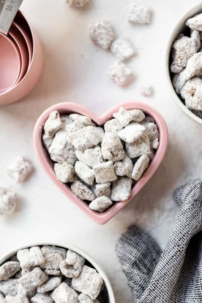 An image of muddy buddies in a heart shaped bowl.