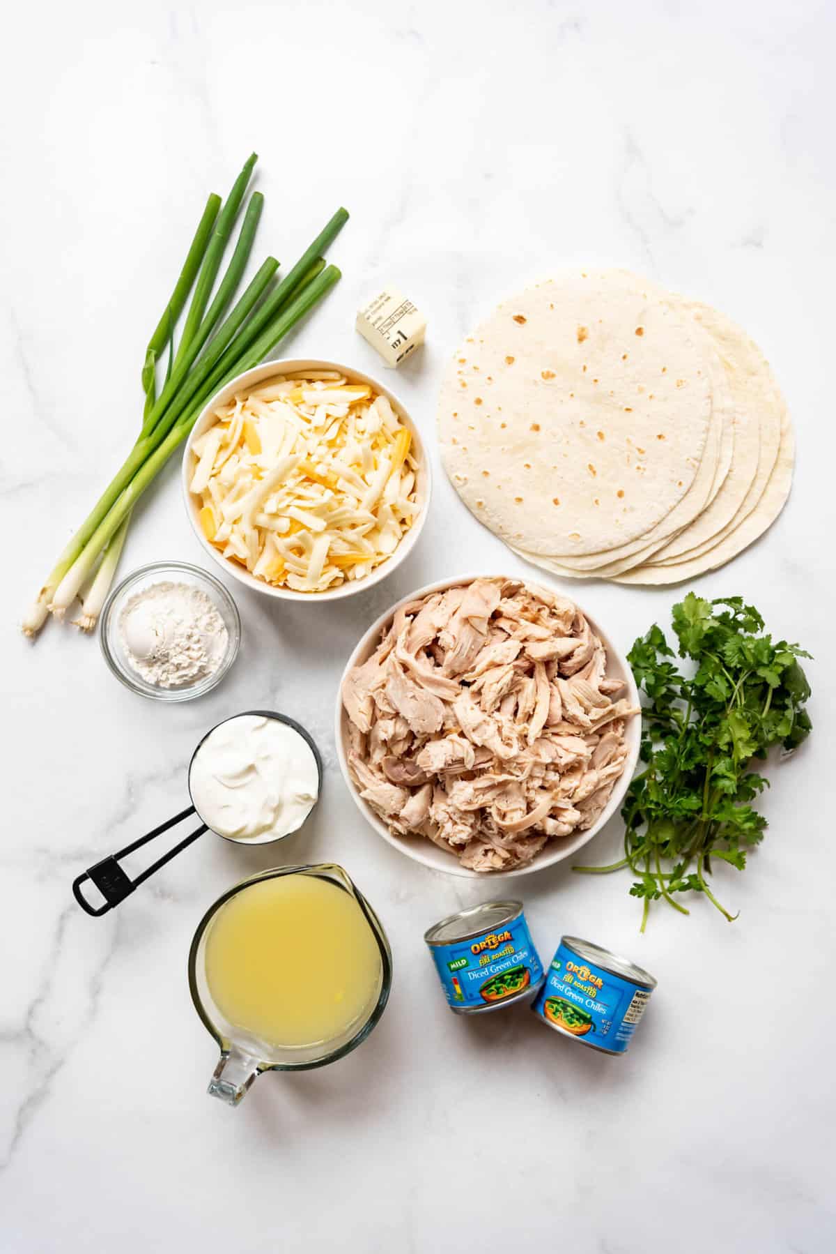 Ingredients for making white chicken enchiladas.