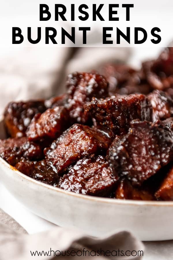 A bowl of smoked beef brisket burnt ends with text overlay.