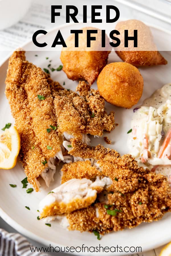 Flaked fried catfish on a white plate with coleslaw and text overlay.