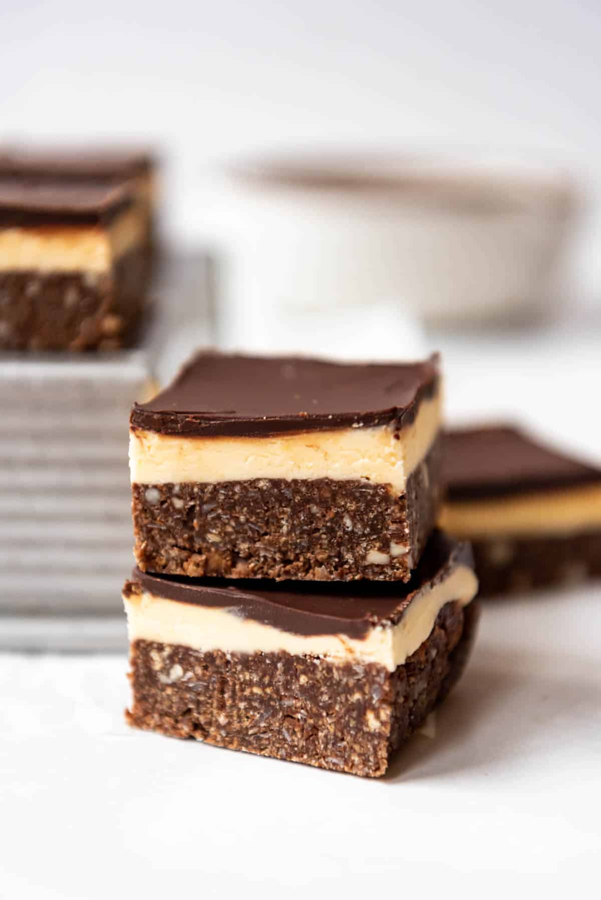 Two nanaimo bars stacked on each other.