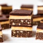 Two Nanaimo bars stacked on top of each other.