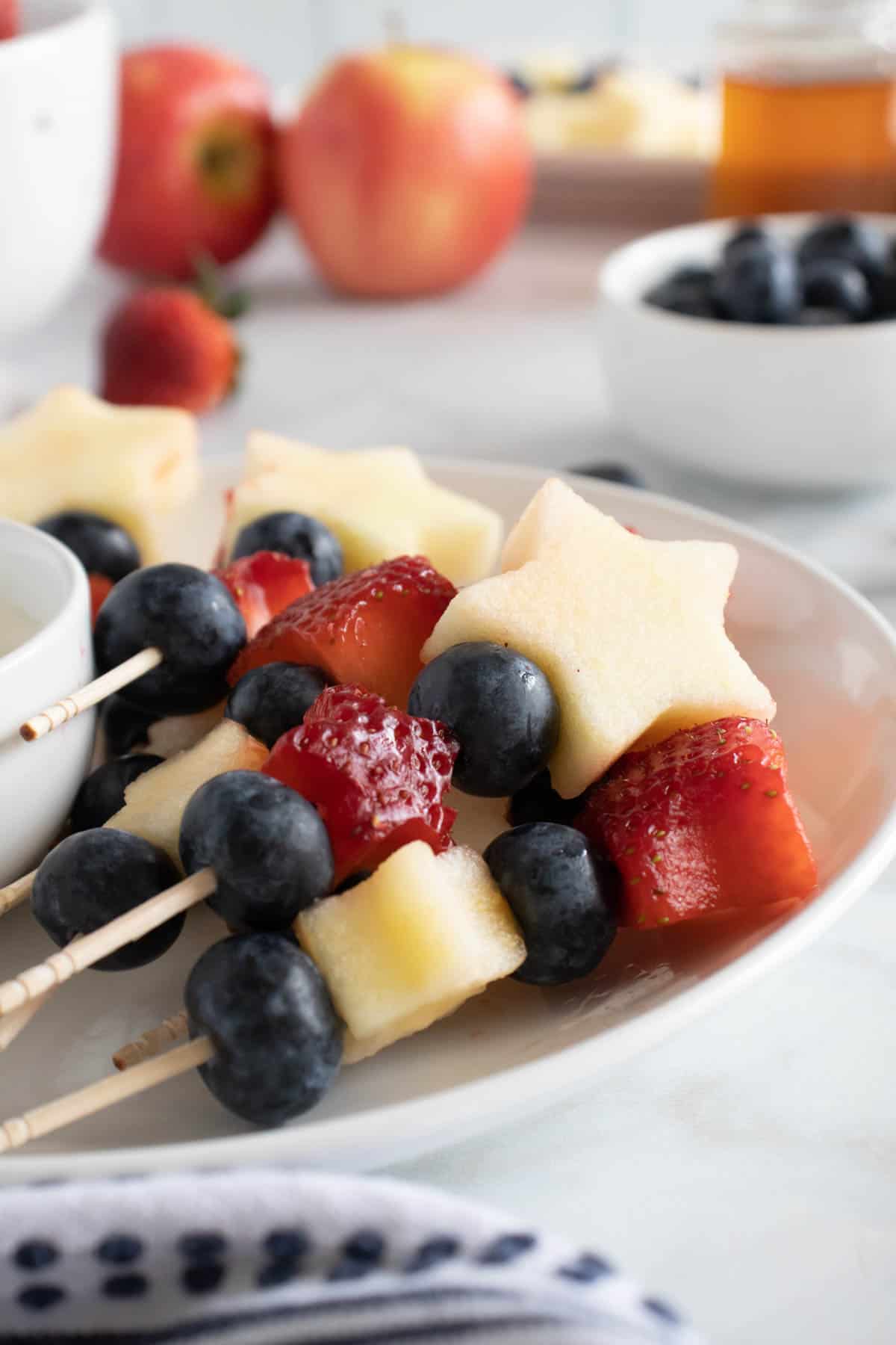 4th of July fruit kabobs made with apples, strawberries, and blueberries.