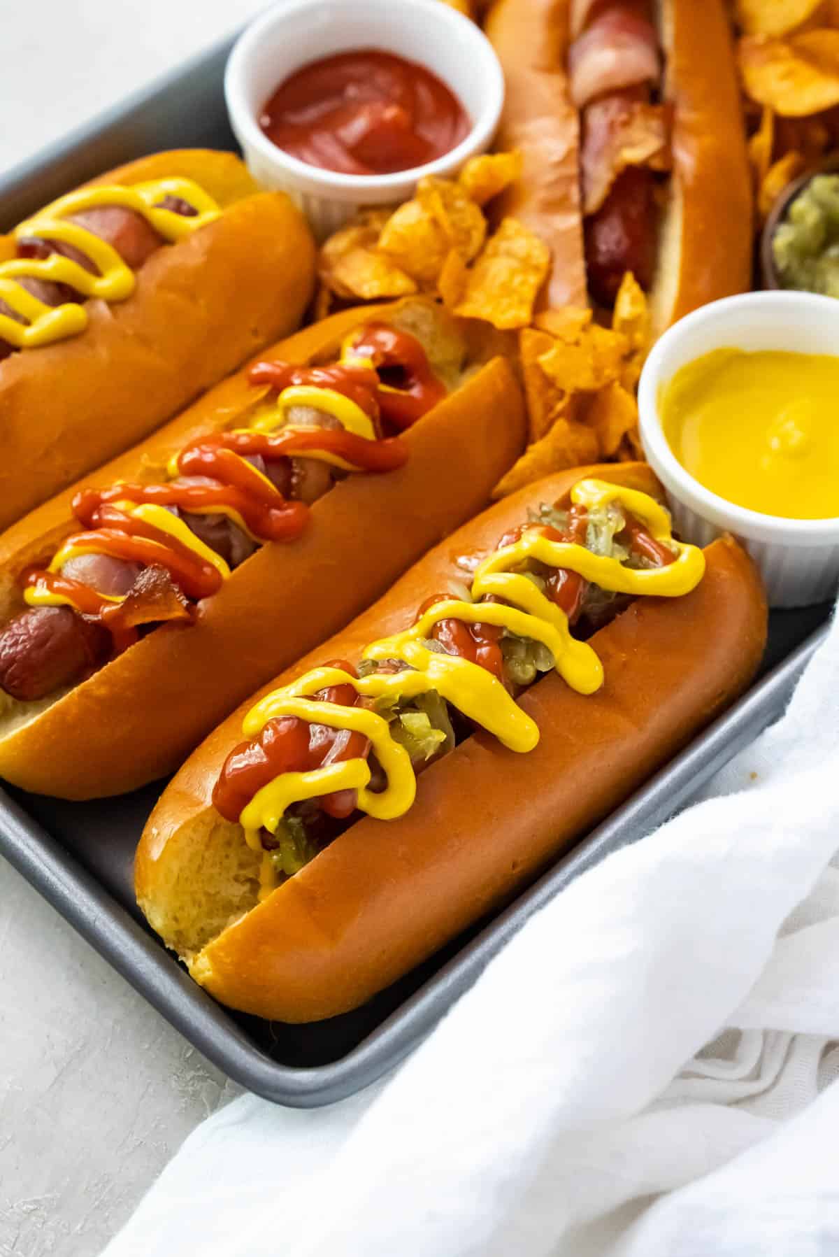 Hot dogs topped with all the fixings.