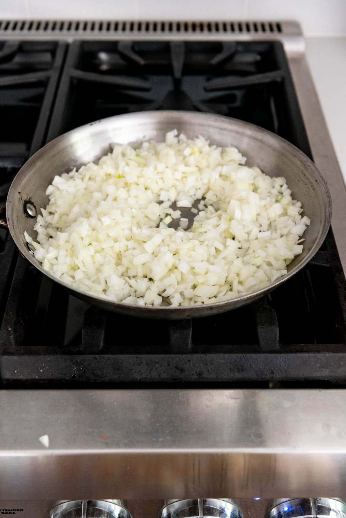 Sauteeing onions in a pan.