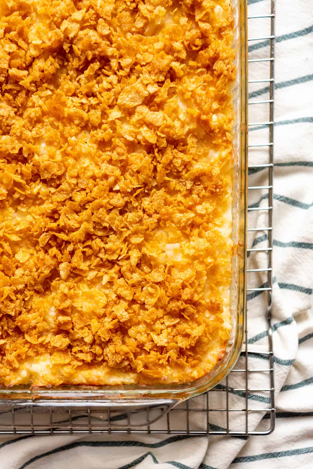 An overhead image of crunchy cornflake topping on funeral potatoes.
