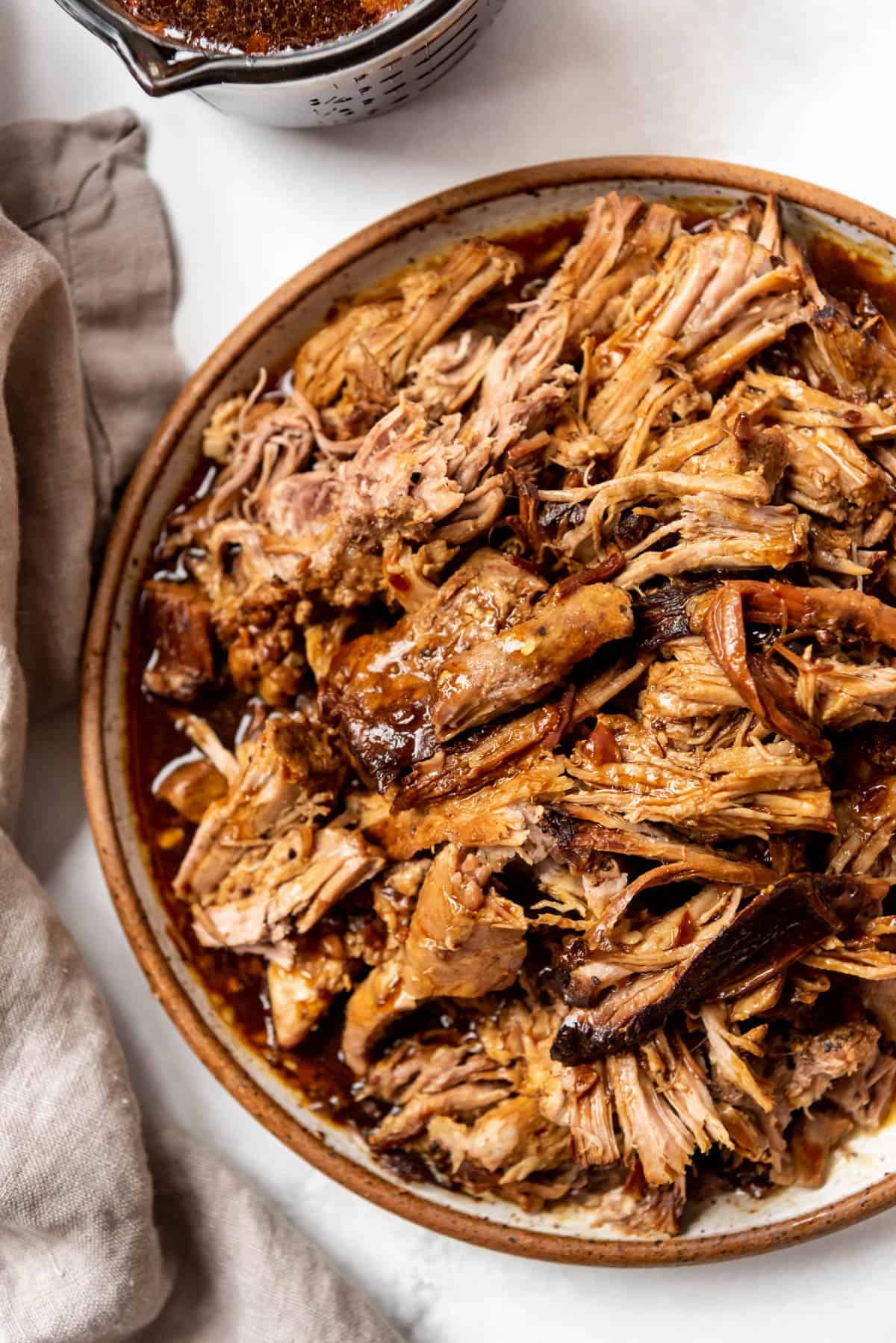 A close image of shredded pork roast that has been made in the Instant Pot.