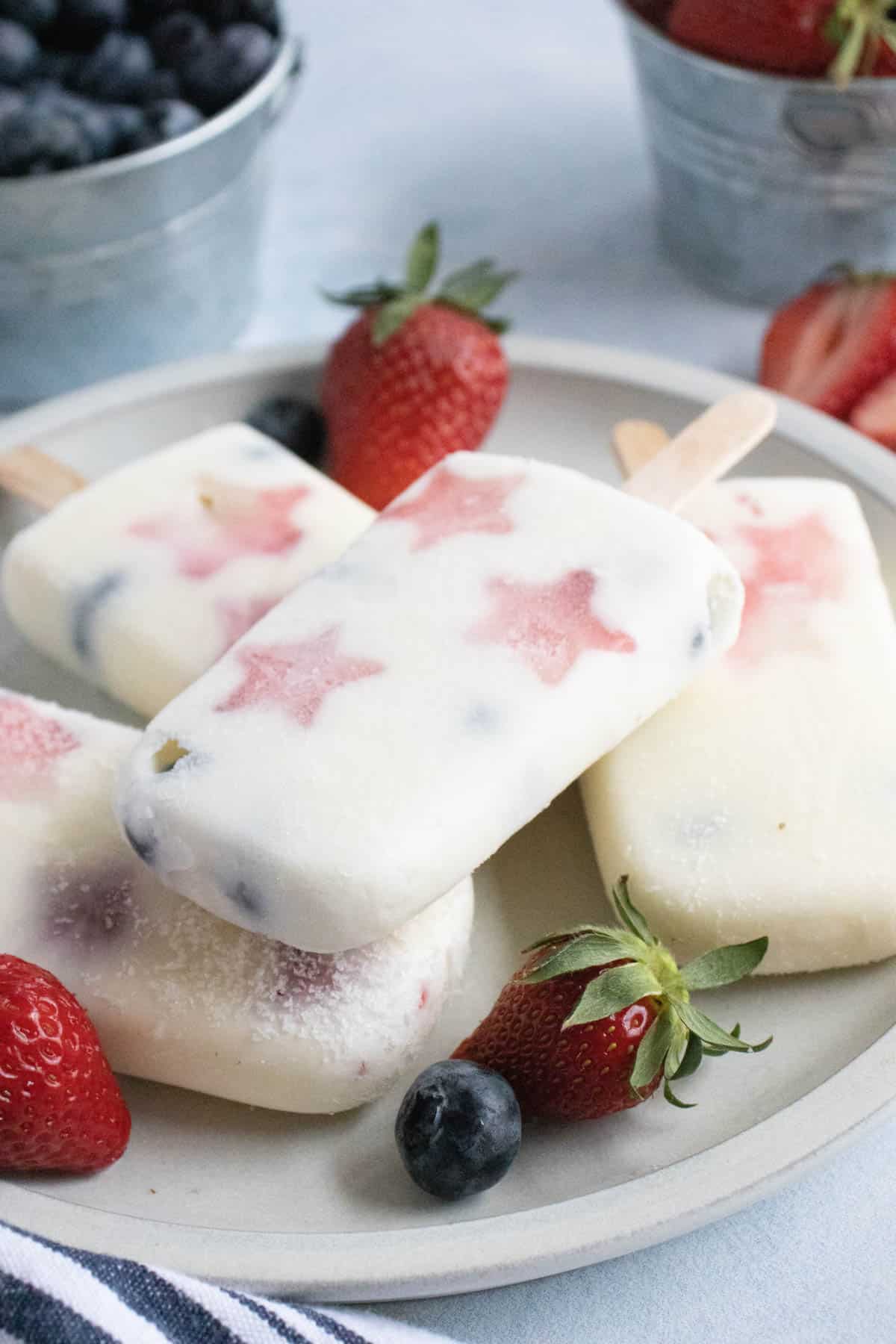 Yogurt popsicles with blueberries and strawberry stars.