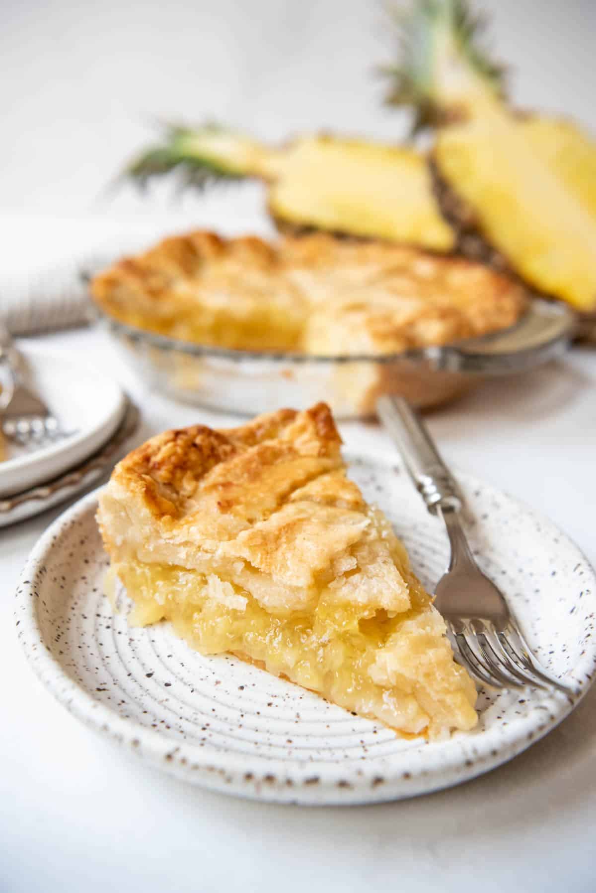 A piece of old-fashioned pineapple pie on a plate.
