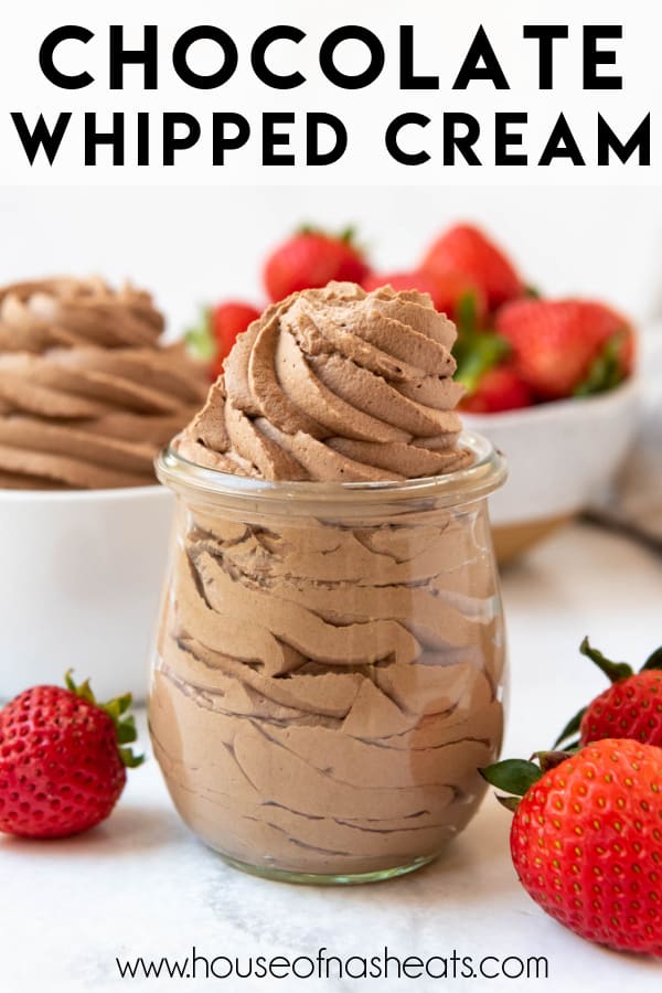 Chocolate whipped cream piped into a glass cup with strawberries around it and text overlay.