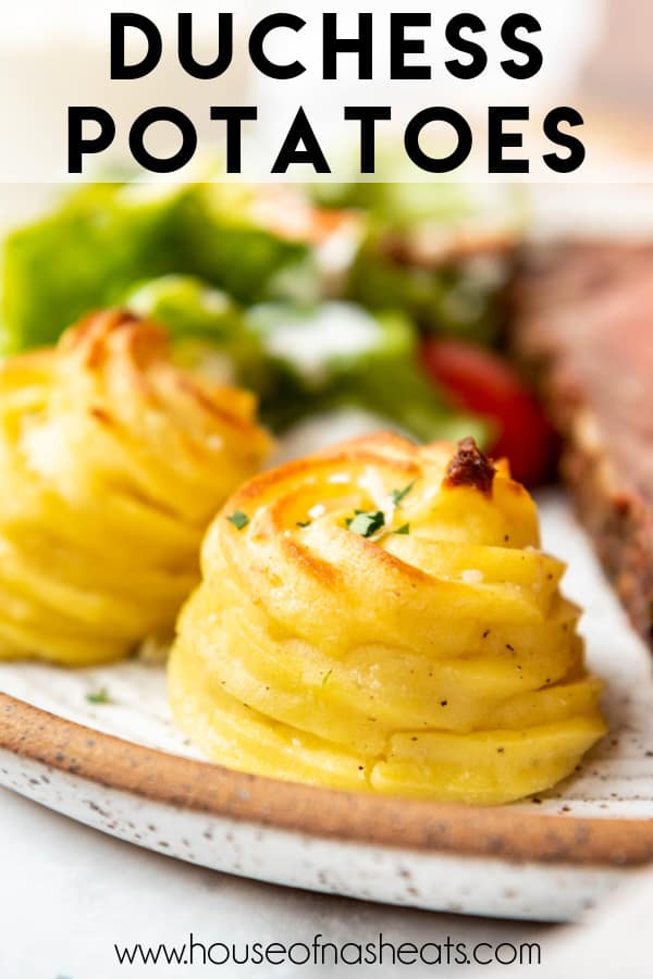 Two duchess potatoes on a plate with text overlay.
