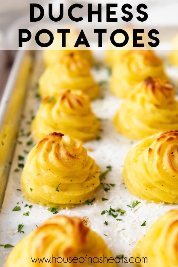 Swirled duchess potatoes with golden brown tops on a baking sheet with text overlay.