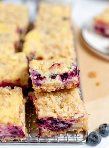 Blueberry cheesecake bars that have been cut into squares.