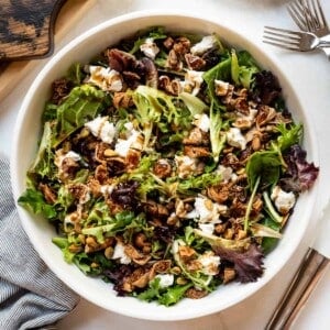 A mixed greens salad with dried fig, pistachio, goat cheese, and an easy balsamic vinaigrette dressing.