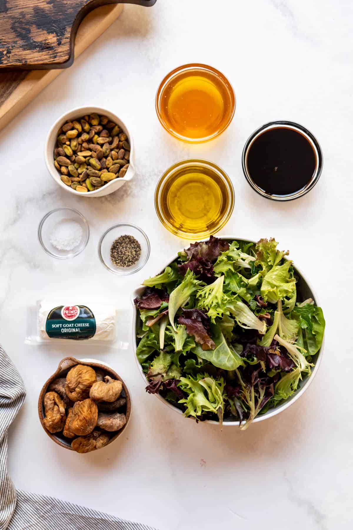 Ingredients for a fig & pistachio salad with easy balsamic dressing.
