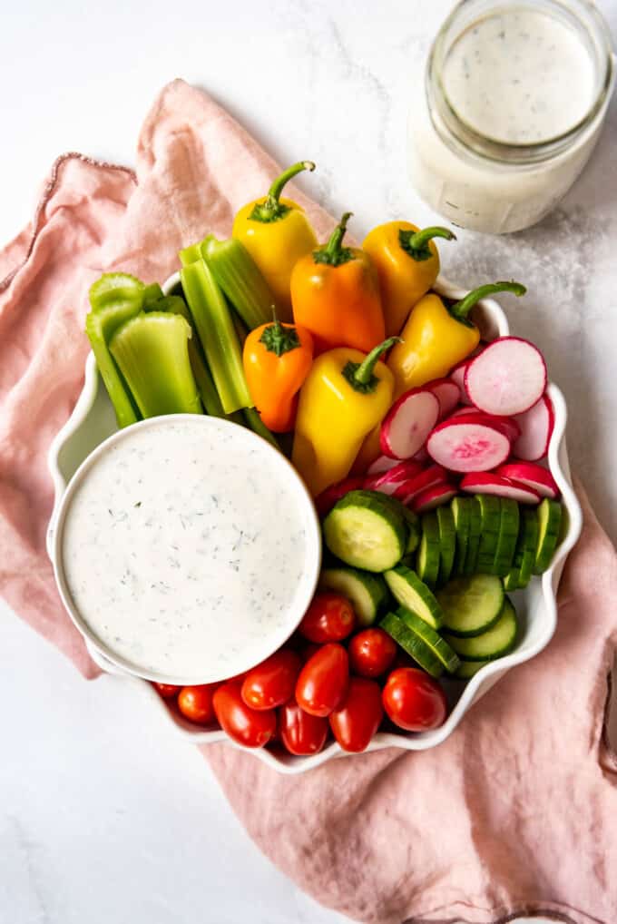A plate of vegetable crudite with a bowl of homemade ranch dressing for dipping.
