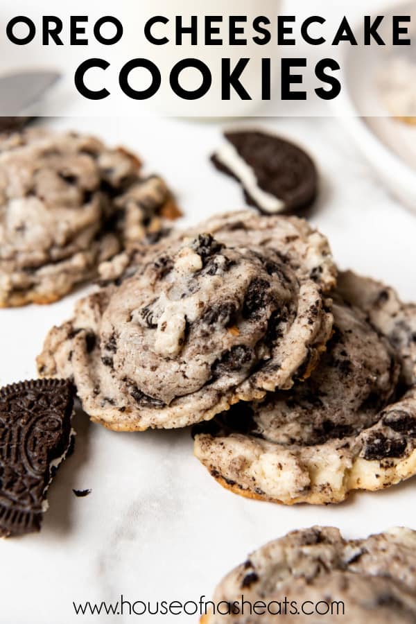 A couple of Oreo cheesecake cookies leaning on each other with text overlay.