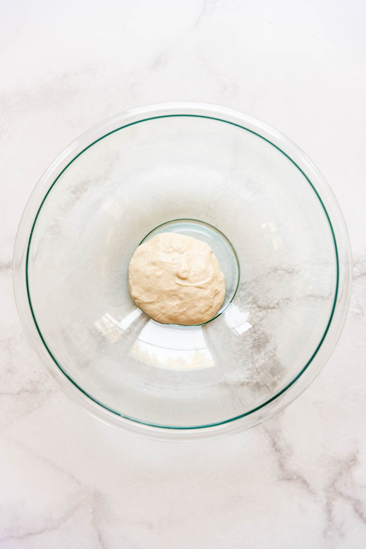 Natural yeast in a large glass bowl.