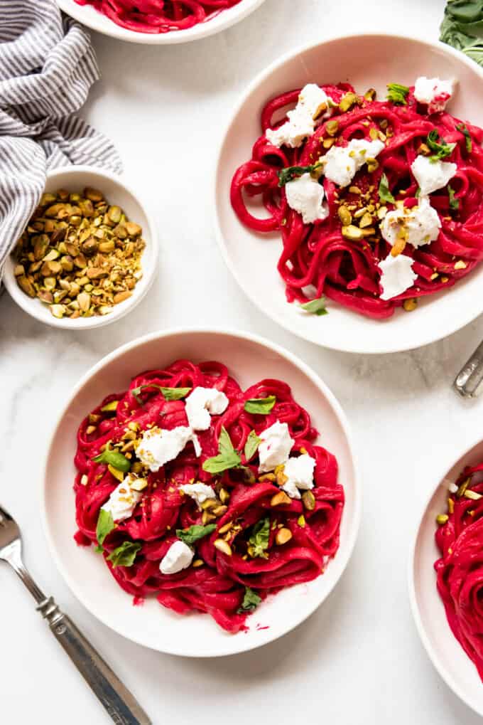 Bowls of TikTok viral beet pasta made with roasted beets.