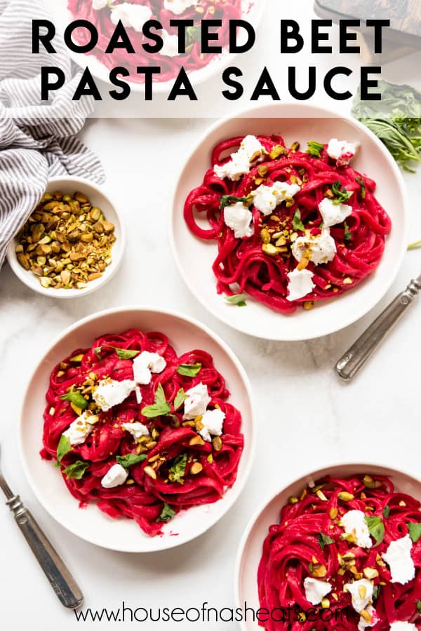 Bowls of pink beet pasta with goat cheese, fresh basil, and pistachios with text overlay.