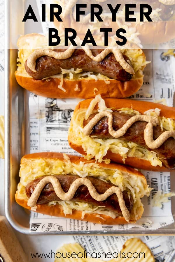 Three air fryer brats in buns with sauerkraut and mustard with text overlay.