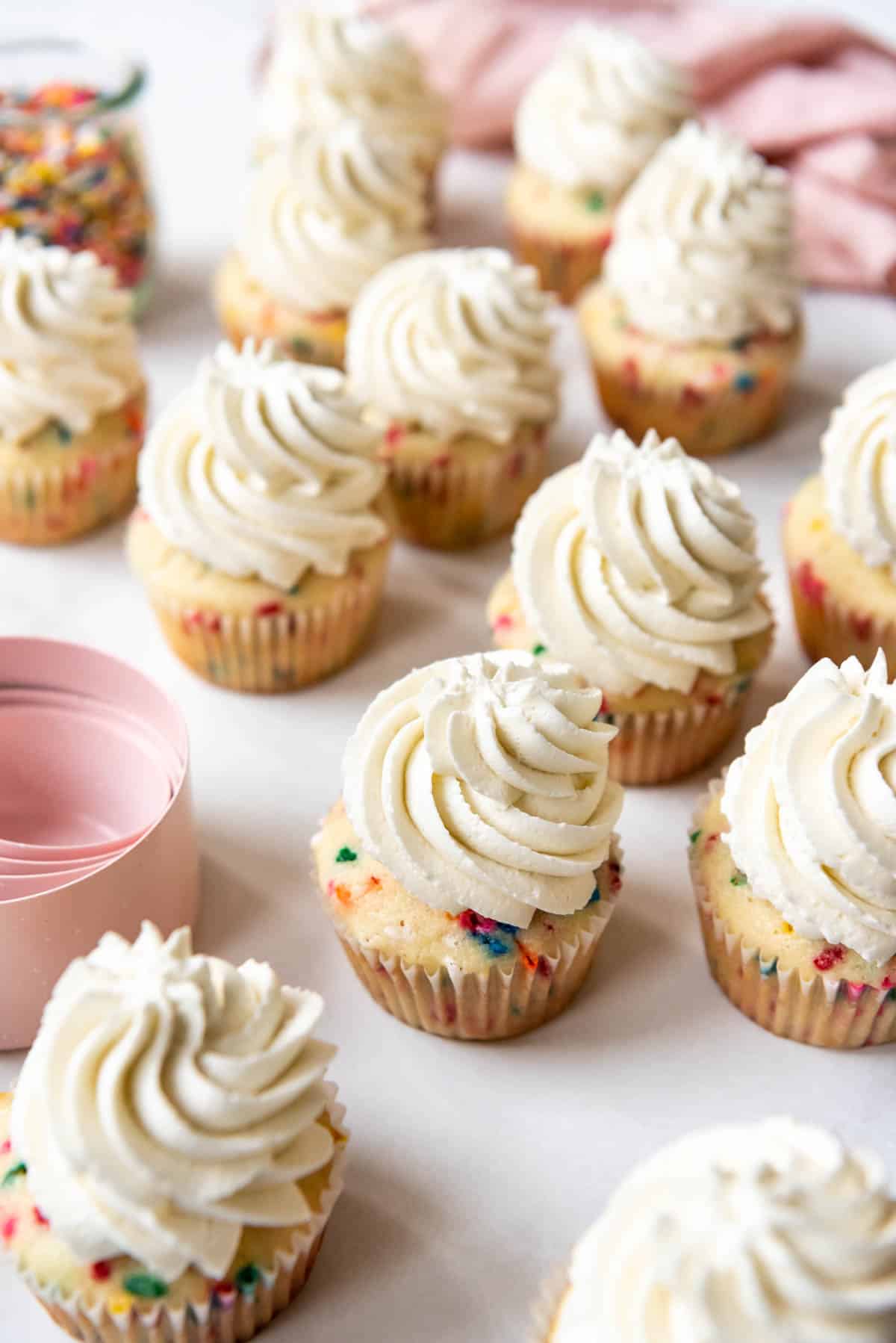 Funfetti cupcakes decorated with Swiss meringue buttercream frosting.